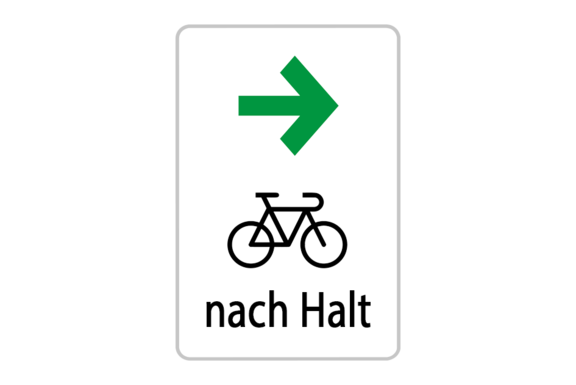 Grüner Pfeil nachts rechts, Fahrradsymbol und Schrift 